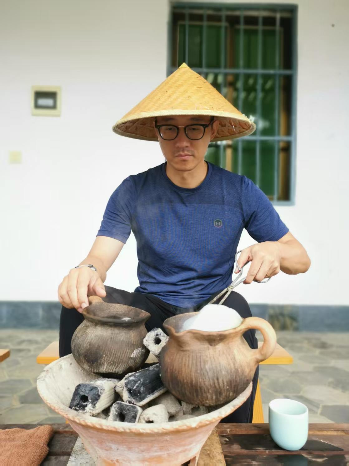 Pu-er tea brewing slowly over a charcoal stove